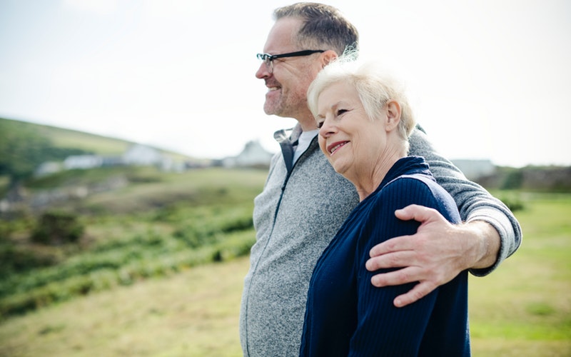 implant-secured dentures, happy couple, Darlene Sand Wall DMD, dentistry